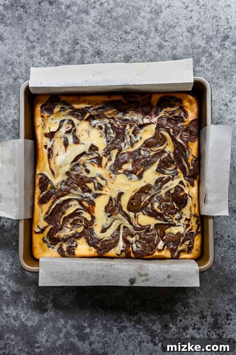 Overhead image of cream cheese swirl brownies fresh out of the oven.