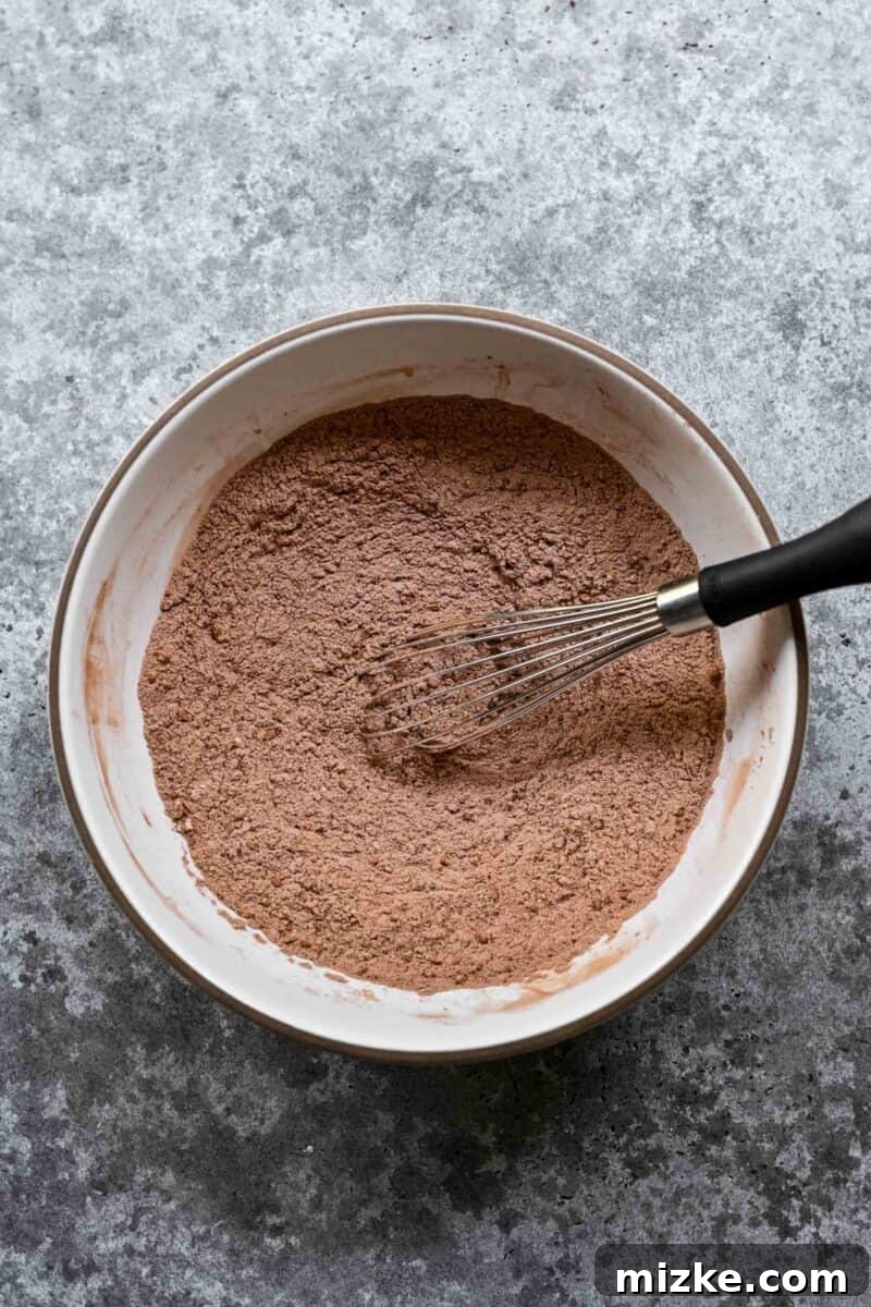 Combining dry ingredients for brownie batter.