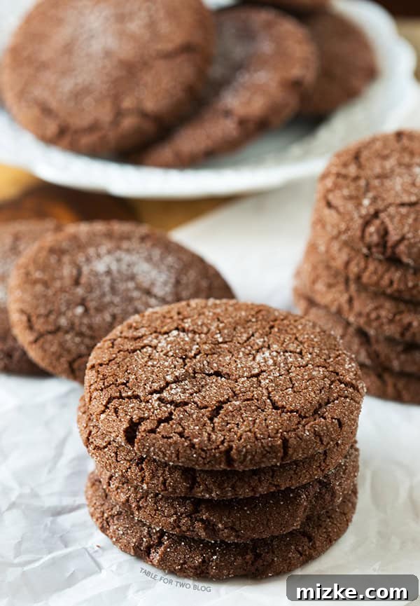 Stack of Chocolate Sugar Cookies dusted with sugar | tablefortwoblog.com