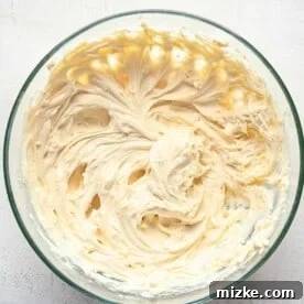 Cream cheese mixture whipped in a glass bowl