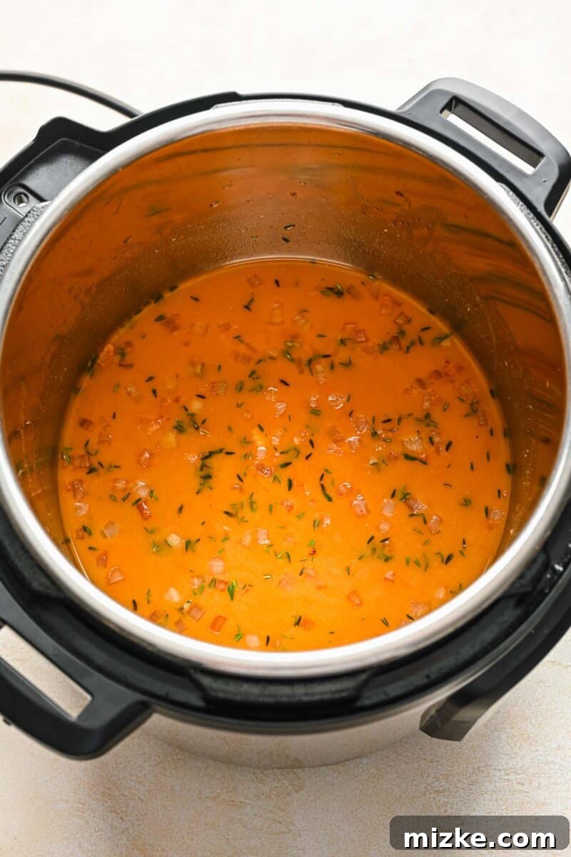 Perfectly Tender Instant Pot Pork Chops 7 Adding chicken broth, Worcestershire, Dijon, brown sugar, and thyme to the Instant Pot