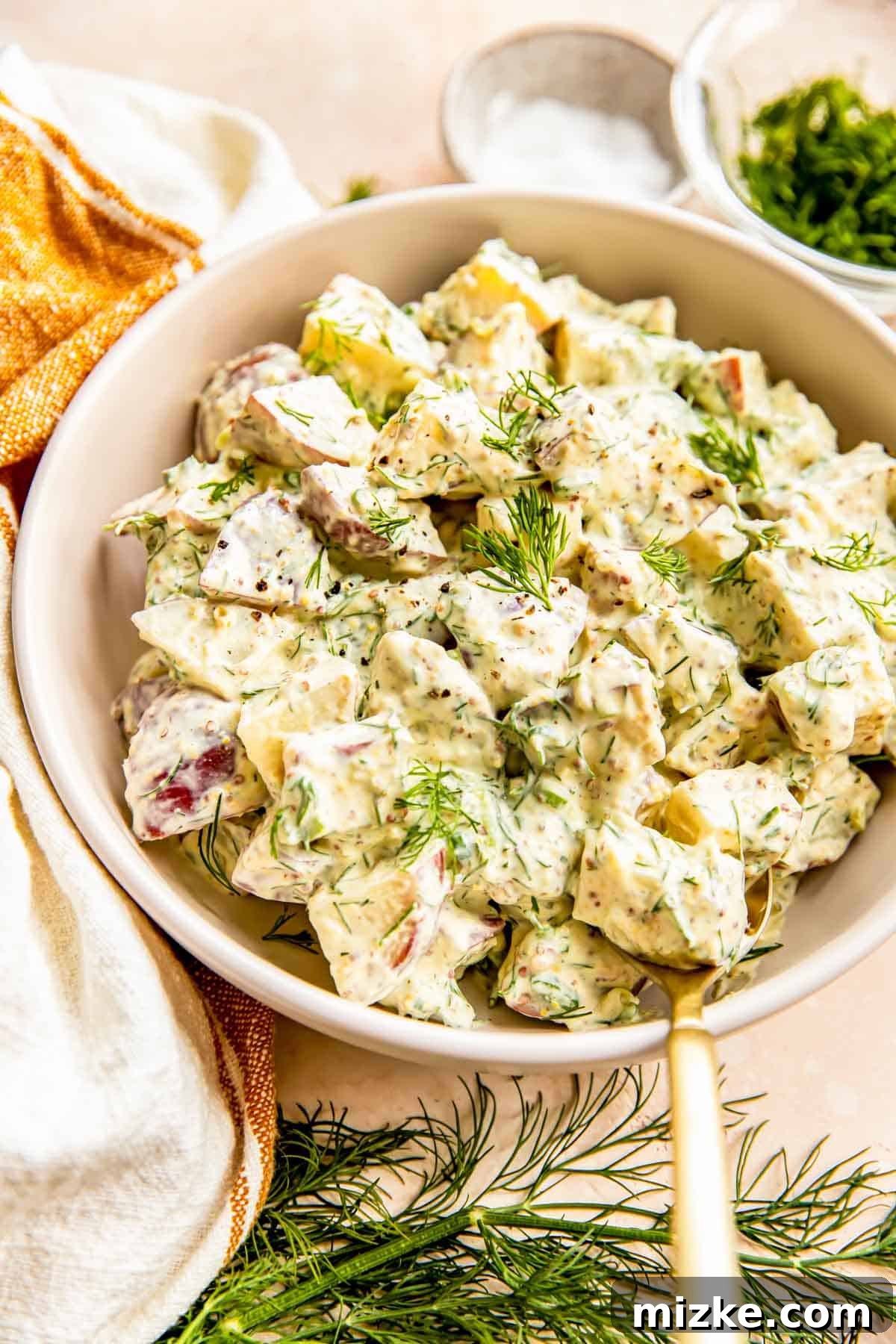 Zesty Dill Potato Salad 2 A large bowl brimming with fresh, creamy dill potato salad, ready to be served at a summer gathering.