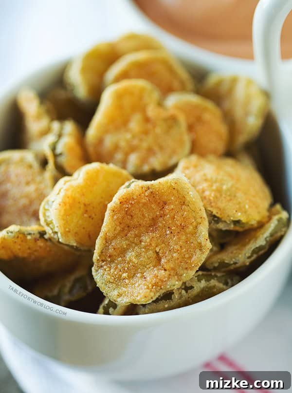 Homemade Fried Pickles | tablefortwoblog.com Close-up of freshly fried dill pickle slices