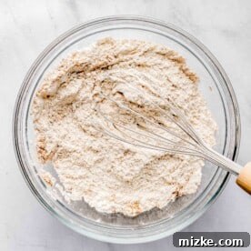 Whisking together dry ingredients for sweet potato bread.