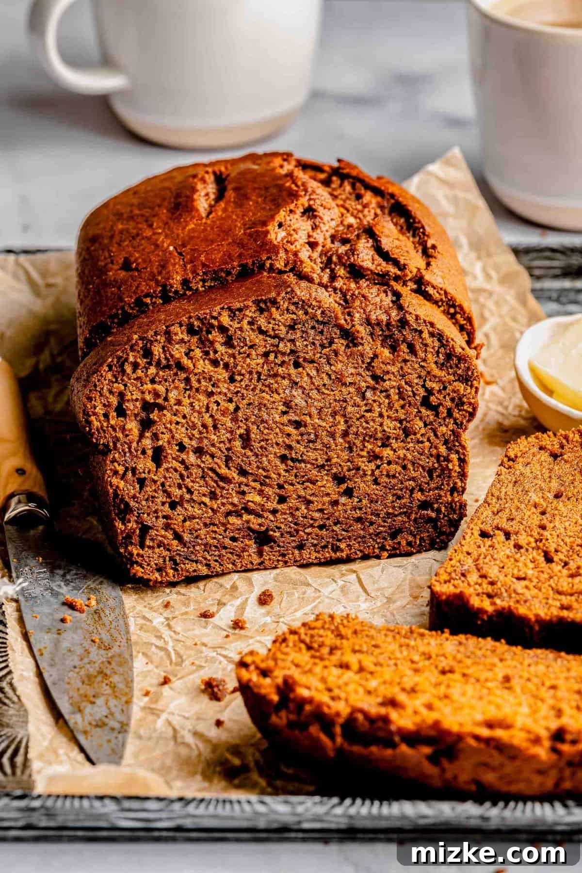 Perfectly baked sweet potato bread, sliced and ready to be savored. This tender, moist, and subtly sweet loaf is a seasonal delight. A freshly baked sweet potato bread, beautifully sliced to reveal its moist and tender interior.