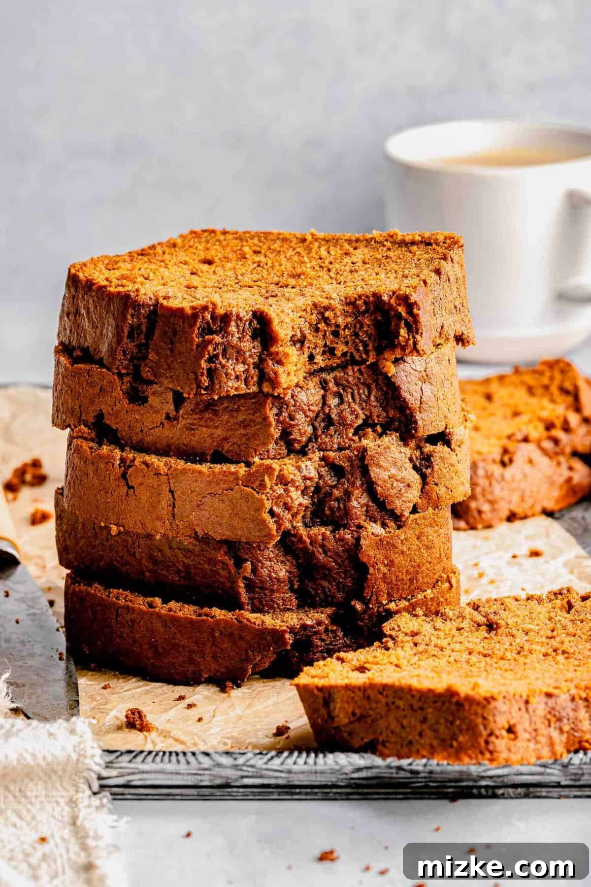 A tempting stack of sweet potato bread slices, showcasing its delightful texture and inviting aroma. Perfect for breakfast, snack, or dessert. A beautifully arranged stack of five slices of moist sweet potato bread, ready to be enjoyed.