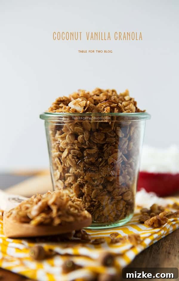 Irresistible Coconut Vanilla Granola - Table for Two Blog Delicious homemade Coconut Vanilla Granola with visible vanilla bean specks