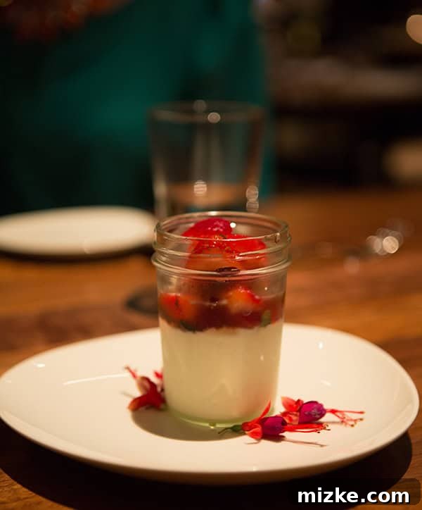 Feasting Through Music City 41 Rich Dark Chocolate Cremeux dessert elegantly plated with vibrant Macerated Berries