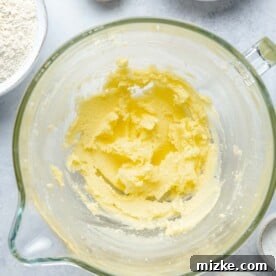 Creaming together butter and sugar for cornbread batter.