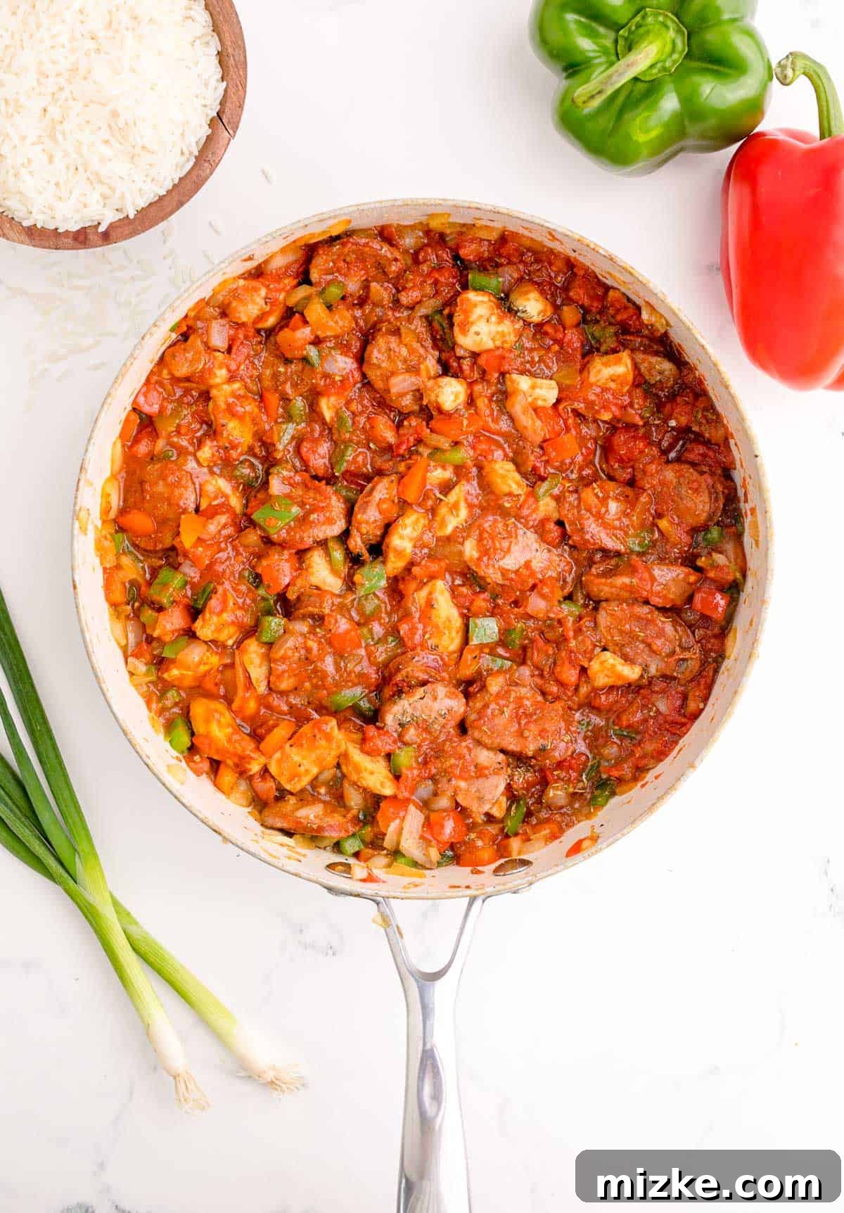 Hearty Chicken and Sausage Jambalaya 7 liquid stirred into vegetables and sausage and chicken in the skillet