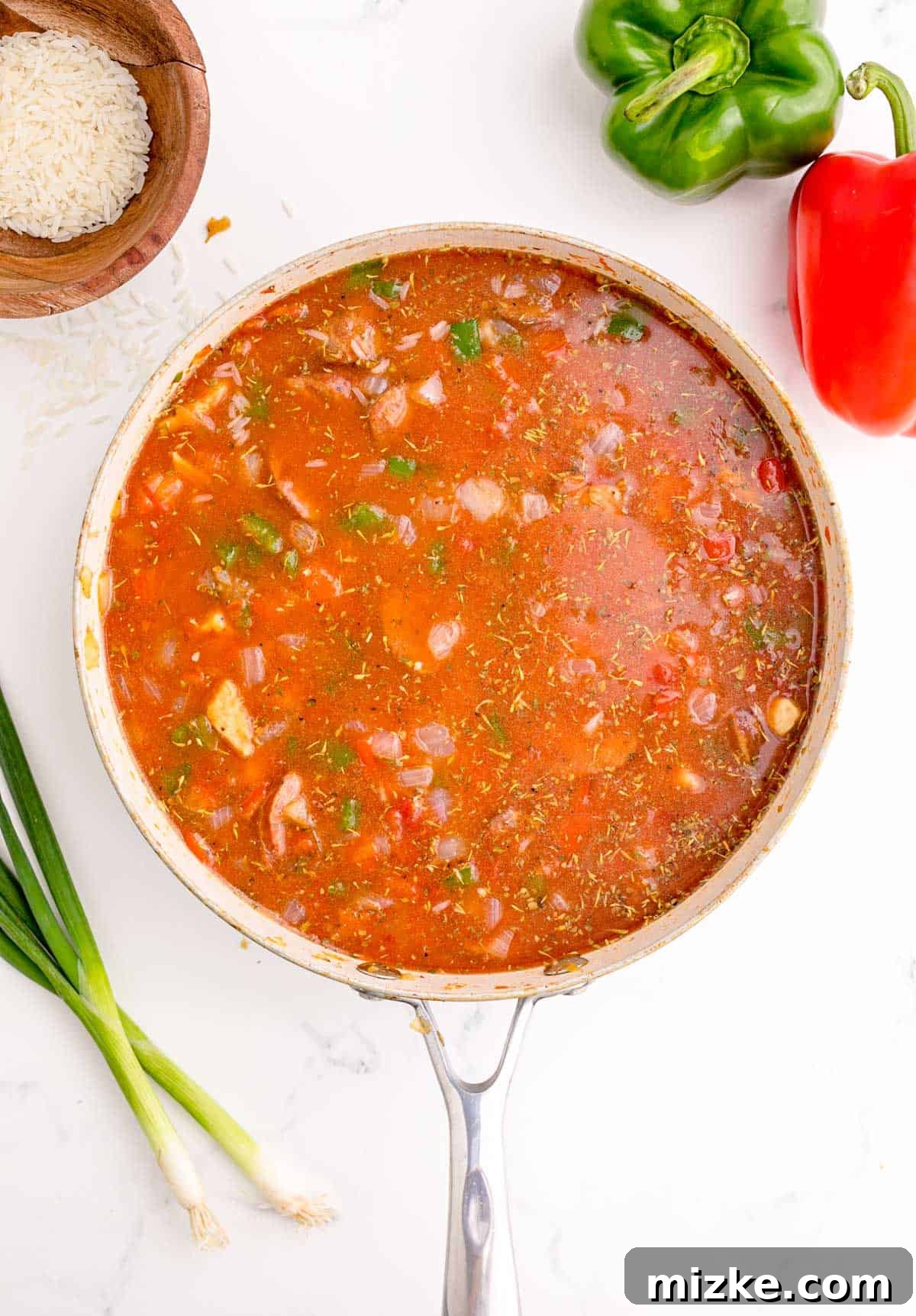 Hearty Chicken and Sausage Jambalaya 8 liquid added to the jambalaya mixture in the skillet