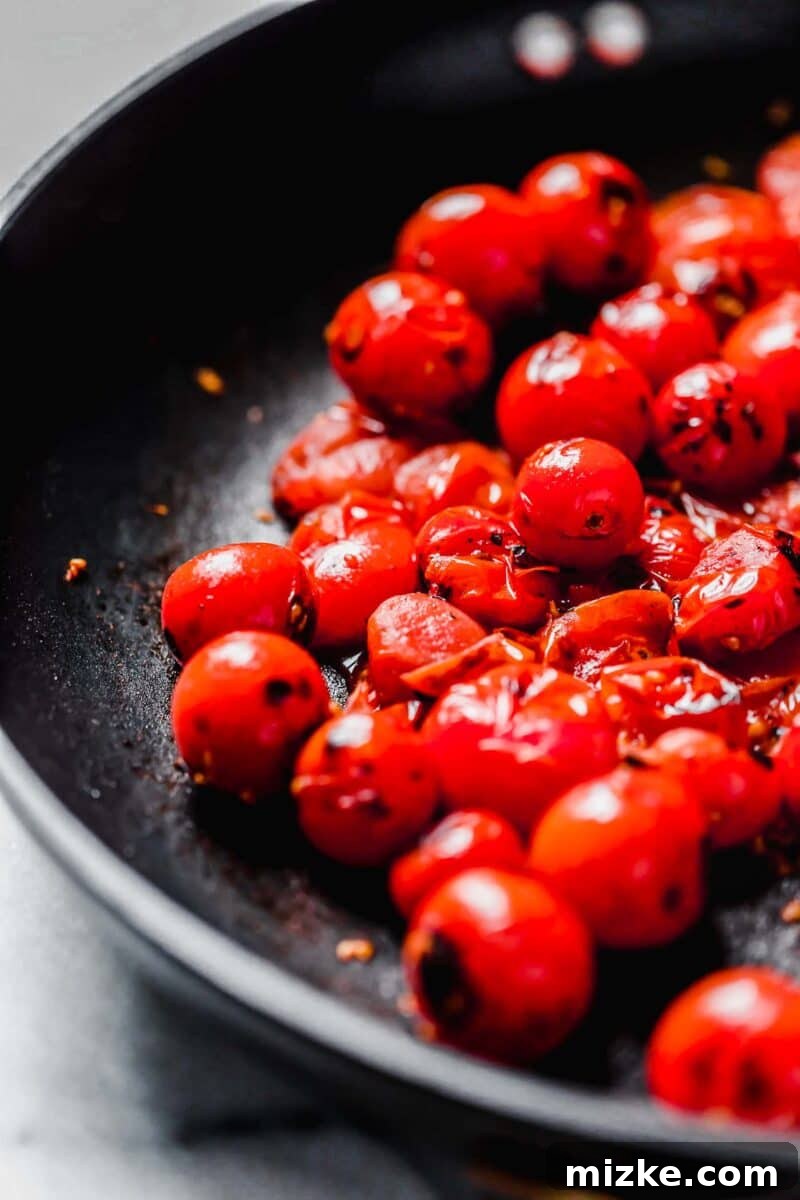 Sun-Kissed Tomato-Herb Chicken 6 Burst cherry tomatoes sizzling in a nonstick skillet, releasing their sweet juices.