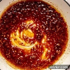 thickened general tso's sauce in a cast iron skillet