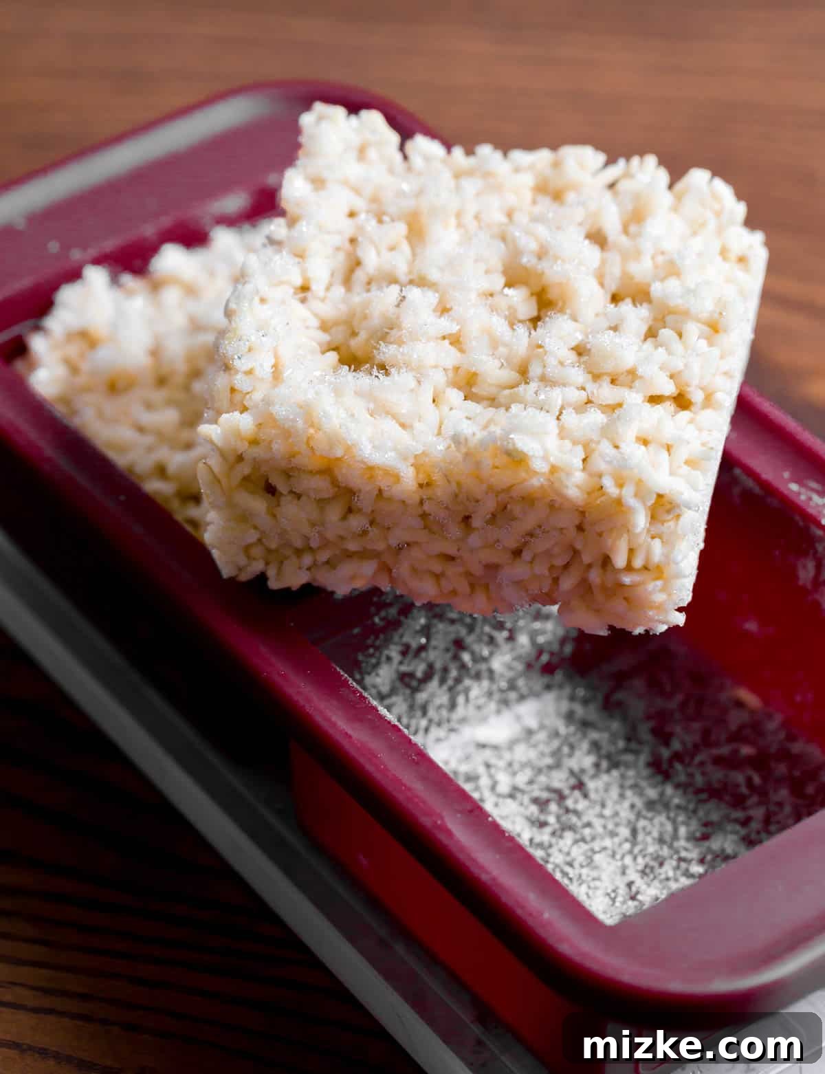 Perfect Brown Rice Every Time 5 a square block of frozen brown rice sits on top of burgundy silicone souper cube freezer trays