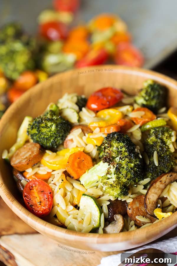 Roasted Vegetables and Andouille Orzo: A Hearty & Flavorful Dinner A beautifully plated dish of Roasted Vegetables and Andouille Orzo, showcasing vibrant colors and enticing textures for a wholesome meal. | tablefortwoblog.com