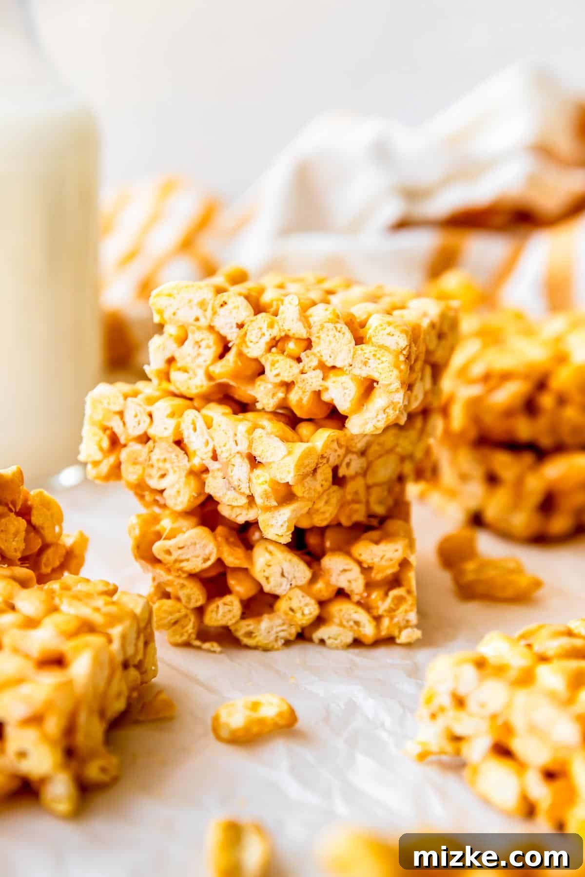 Wholesome Grain Bars 13 A stack of golden cereal bars is neatly arranged on a countertop, ready to be enjoyed.