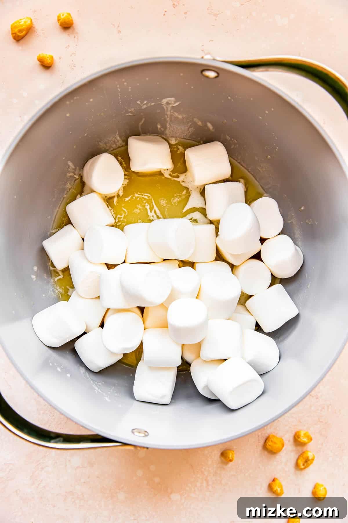 Wholesome Grain Bars 5 Large marshmallows have just been added to a skillet containing melted butter, beginning the melting process.