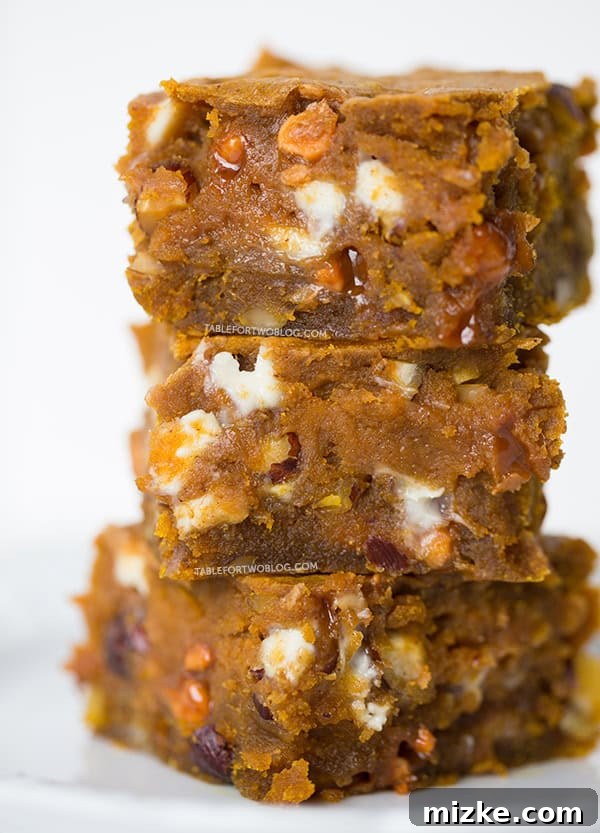 Delicious Homemade Pumpkin Blondies on a white plate | tablefortwoblog.com