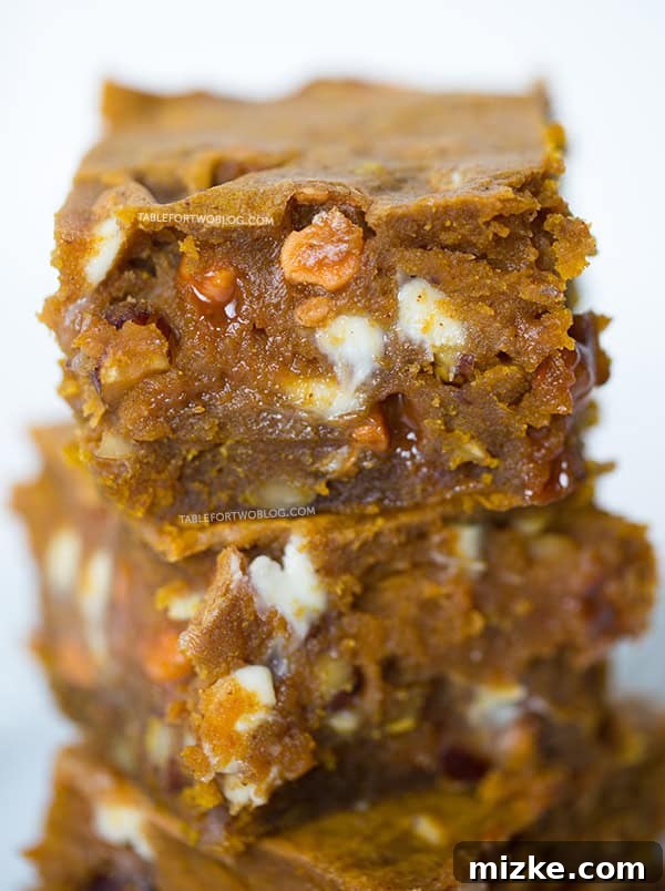 Freshly baked Pumpkin Blondies cooling on a wire rack | tablefortwoblog.com
