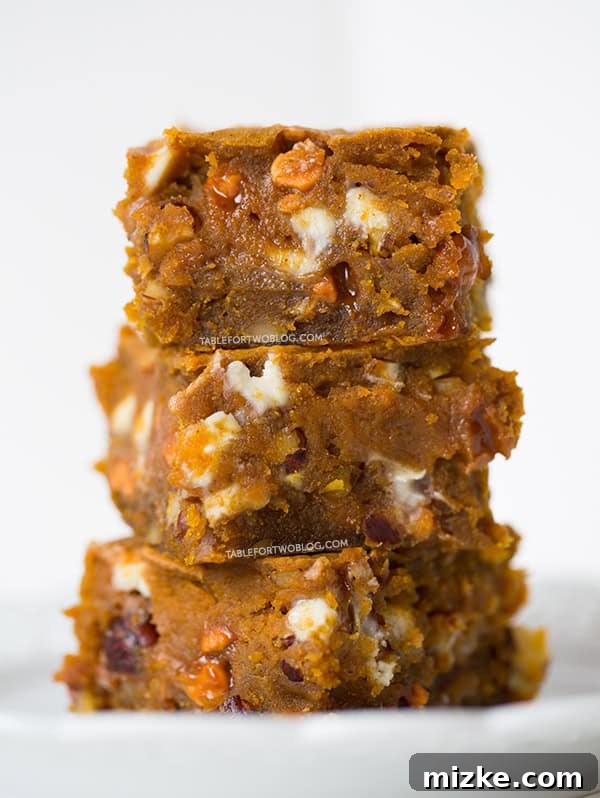 Close-up of a single Pumpkin Blondie with visible chips and nuts | tablefortwoblog.com