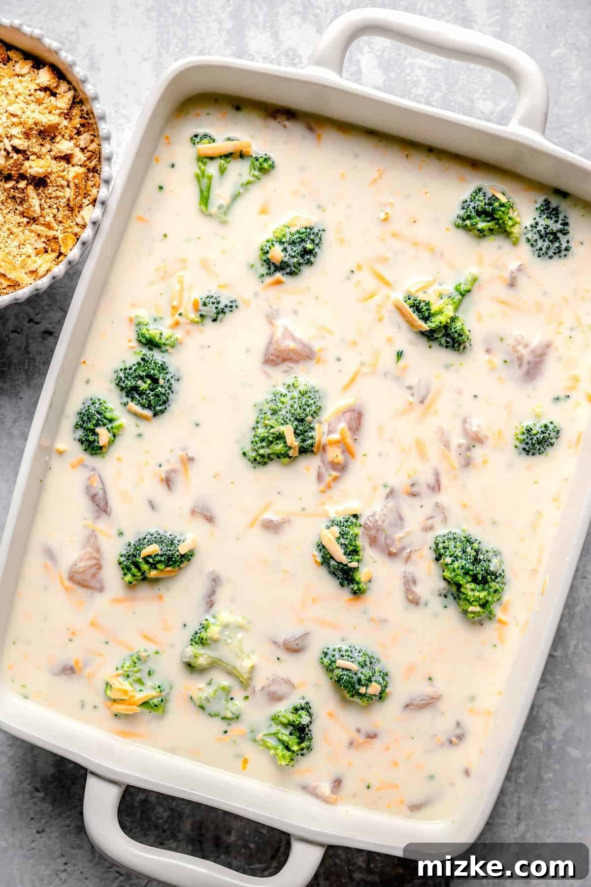 This cheesy chicken broccoli rice casserole is topped with buttery Ritz crackers and comes together so quickly. It's a perfect weeknight meal. Chicken broccoli rice casserole before adding the Ritz crackers.