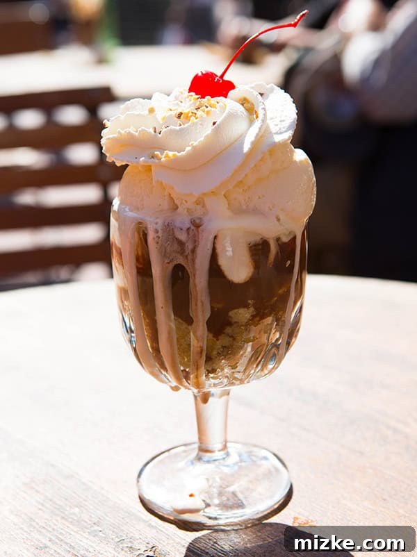 Indulge in a Ghirardelli cookie bottom sundae. A mouth-watering cookie bottom sundae from Ghirardelli Square, loaded with toppings.