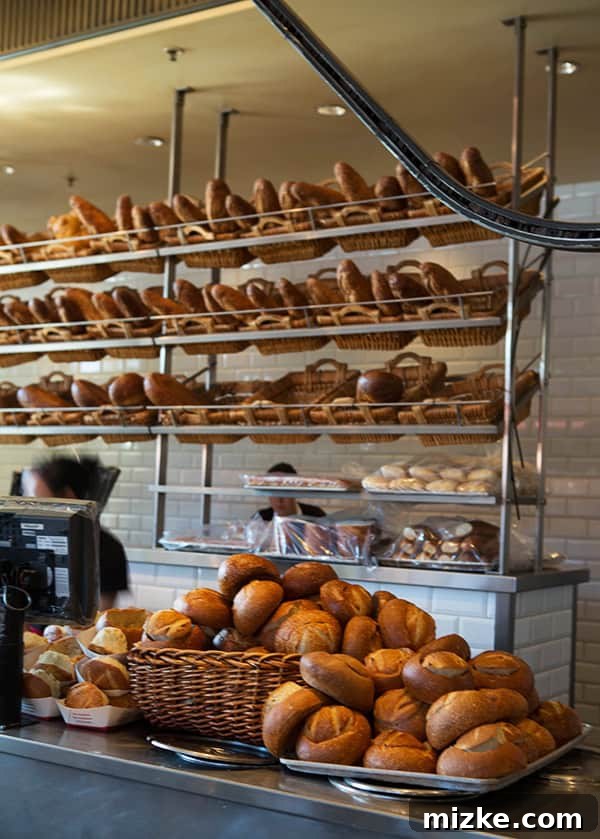 Inside Boudin Bakery, a feast for the eyes and palate. Interior view of Boudin Bakery, showcasing its expansive display of baked goods.