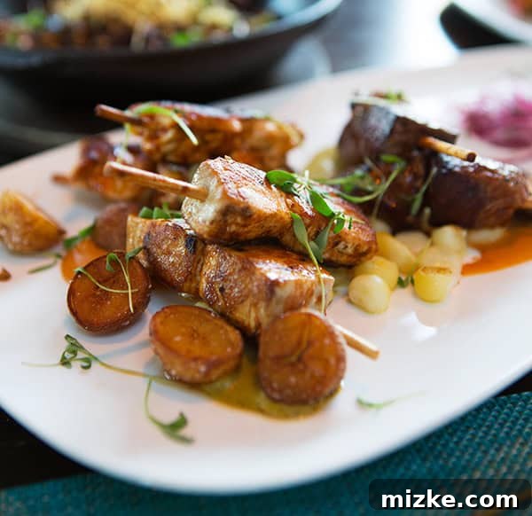 Peruvian anticuchos, a savory and traditional dish. A selection of Peruvian anticuchos (skewers) on a plate.