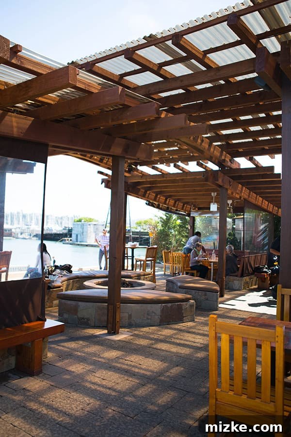 Bar Bocce: Riverside dining with a bocce court and stunning views. Outdoor seating area at Bar Bocce in Sausalito, with a fire pit and beach view.