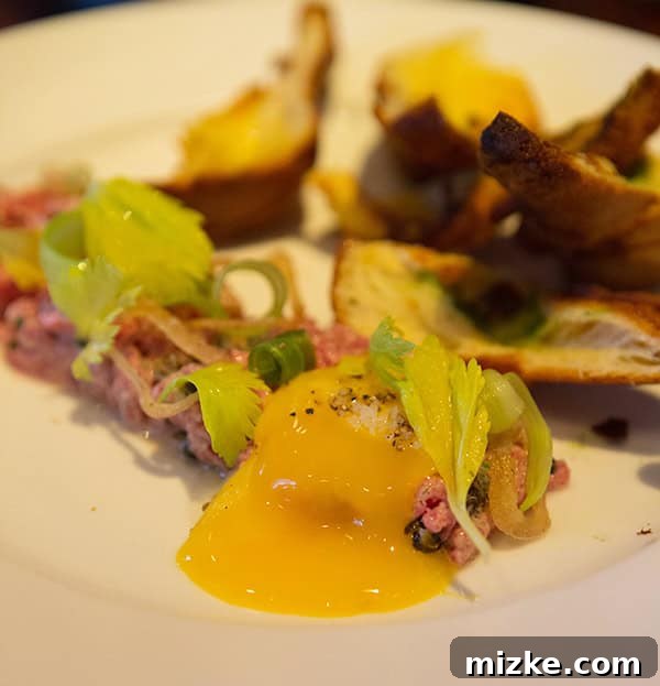 The delectable Kobe tartare, a must-try appetizer. Another angle of the Kobe tartare, emphasizing its artful presentation.