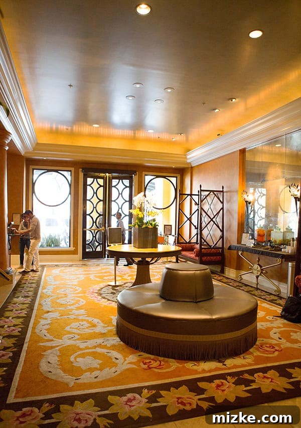 The magnificent lobby of Kimpton Hotel Monaco. The opulent lobby of Kimpton Hotel Monaco, showcasing its grand design and luxurious seating.