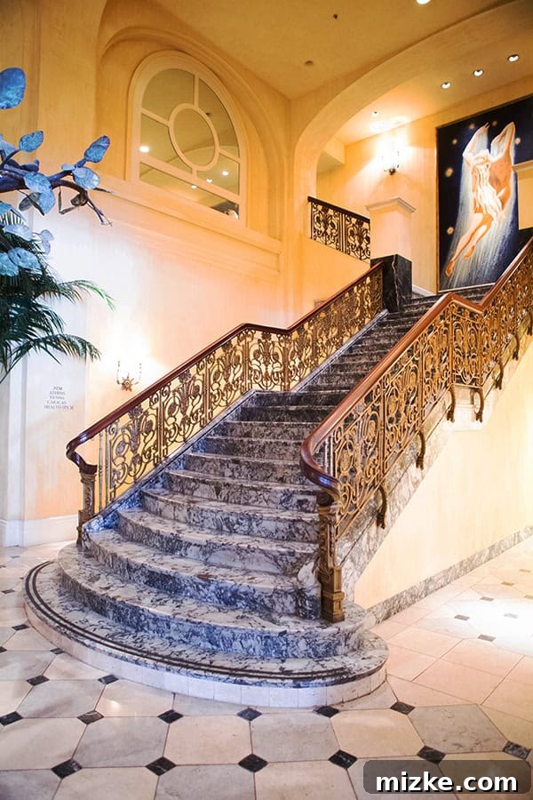 An architectural marvel: the grand staircase at Hotel Monaco. A magnificent grand staircase in the hotel lobby, adorned with elegant decor.