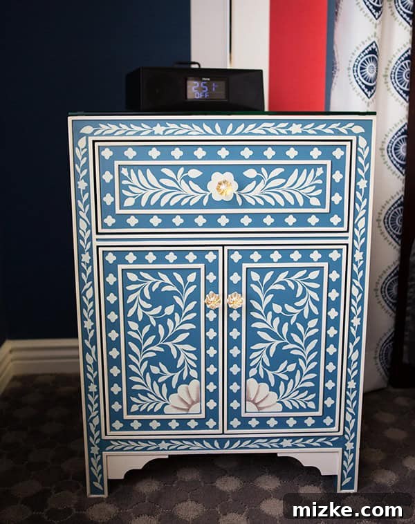 A chic and functional nightstand. A stylish bedside table with a unique pattern.