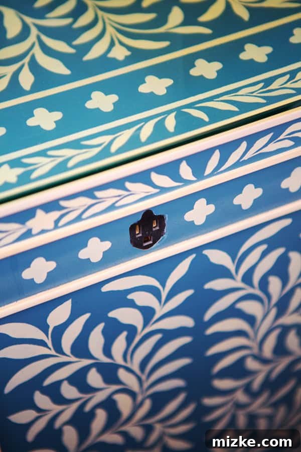 Innovative bedside outlet for convenience. Close-up of a bedside table showing a cleverly integrated power outlet.