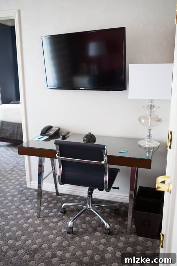 A functional and stylish workspace in the suite. A well-appointed business area in the hotel suite, with a desk and chair.
