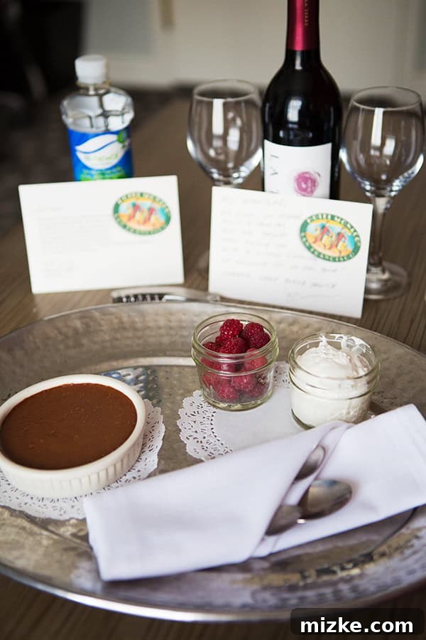 Thoughtful amenities and delicious treats from Kimpton Hotel Monaco. A complimentary bottle of wine and a decadent chocolate pudding from the hotel.