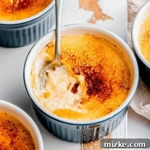 Digging a spoon into creme brulee.