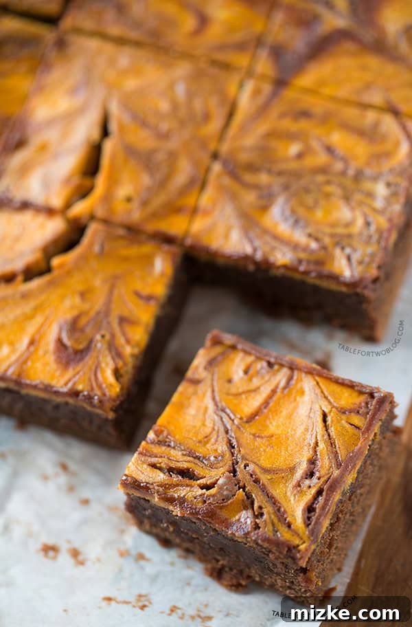 Pumpkin Cheesecake Swirl Brownies | tablefortwoblog.com Decadent Pumpkin Cheesecake Swirl Brownies - A perfect fall dessert!