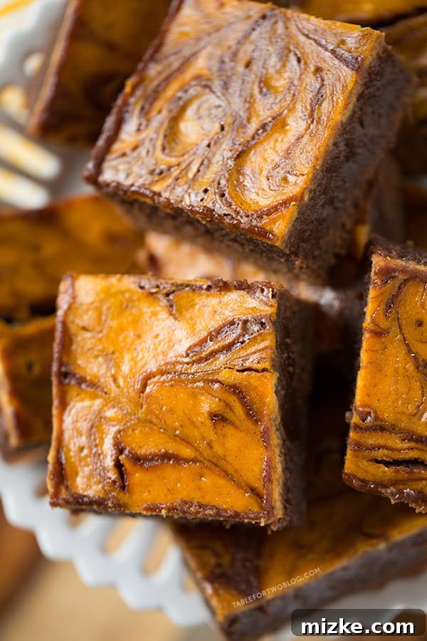 Pumpkin Cheesecake Swirl Brownies | tablefortwoblog.com Serving suggestion for Pumpkin Cheesecake Swirl Brownies