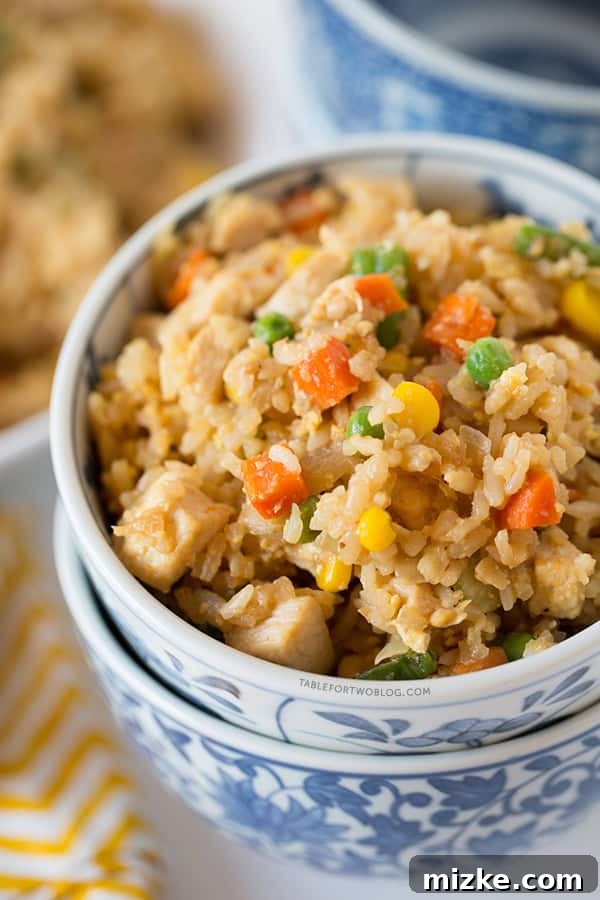 Take-out, fake-out chicken fried rice is so easy to whip up yourself that you won't need to call for take-out! Recipe on tablefortwoblog.com Take-out, fake-out chicken fried rice is so easy to whip up yourself that you won't need to call for take-out! Recipe on tablefortwoblog.com