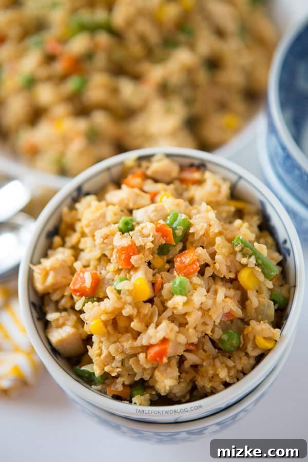 Take-out, fake-out chicken fried rice is so easy to whip up yourself that you won't need to call for take-out! Recipe on tablefortwoblog.com Take-out, fake-out chicken fried rice is so easy to whip up yourself that you won't need to call for take-out! Recipe on tablefortwoblog.com