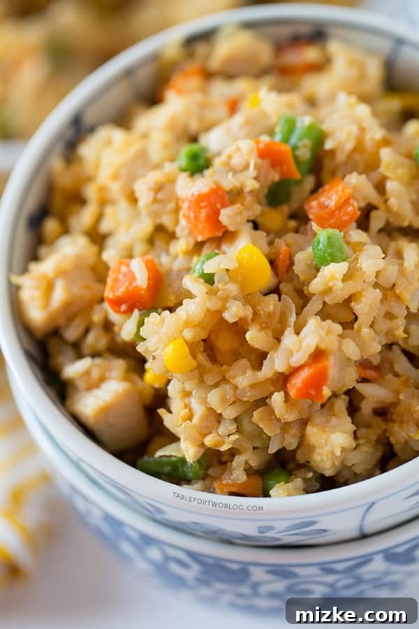 Take-out, fake-out chicken fried rice is so easy to whip up yourself that you won't need to call for take-out! Recipe on tablefortwoblog.com Take-out, fake-out chicken fried rice is so easy to whip up yourself that you won't need to call for take-out! Recipe on tablefortwoblog.com