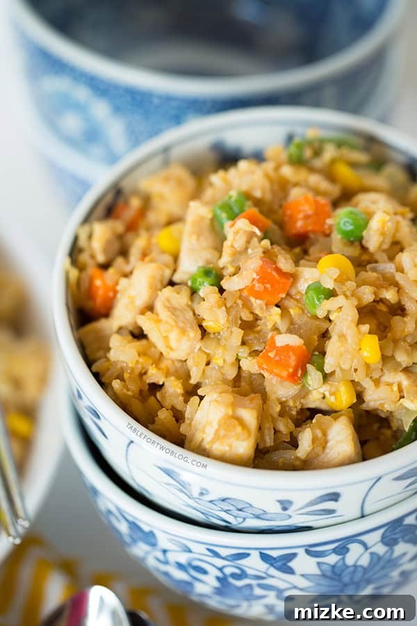 Take-out, fake-out chicken fried rice is so easy to whip up yourself that you won't need to call for take-out! Recipe on tablefortwoblog.com Take-out, fake-out chicken fried rice is so easy to whip up yourself that you won't need to call for take-out! Recipe on tablefortwoblog.com