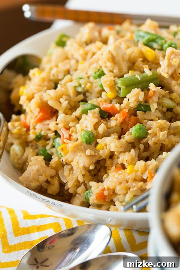 Take-out, fake-out chicken fried rice is so easy to whip up yourself that you won't need to call for take-out! Recipe on tablefortwoblog.com Take-out, fake-out chicken fried rice is so easy to whip up yourself that you won't need to call for take-out! Recipe on tablefortwoblog.com