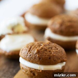 Spiced Gingerbread Whoopie Delights 2 A beautifully plated mini gingerbread whoopie pie, ready to be served at a holiday party or family get-together.
