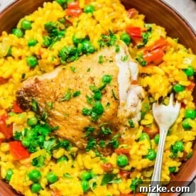 20 Quick Chicken Dinners for Busy Weeknight Meals 12 Overhead view of arroz con pollo in bowl with fork
