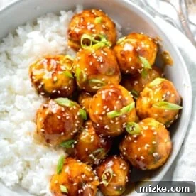20 Quick Chicken Dinners for Busy Weeknight Meals 5 teriyaki chicken meatballs glazed in teriyaki sauce with fresh scallions and sesame seeds