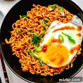 Buldak ramen served in a bowl with an egg.