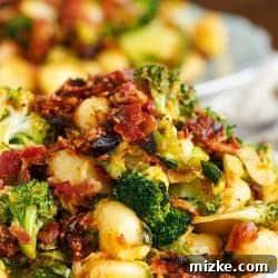 If you have 25 minutes then have enough time to make this quick weeknight dinner entree of bacon gnocchi with broccoli and shaved brussels!