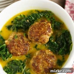 Curry meatballs and kale stew in a bowl